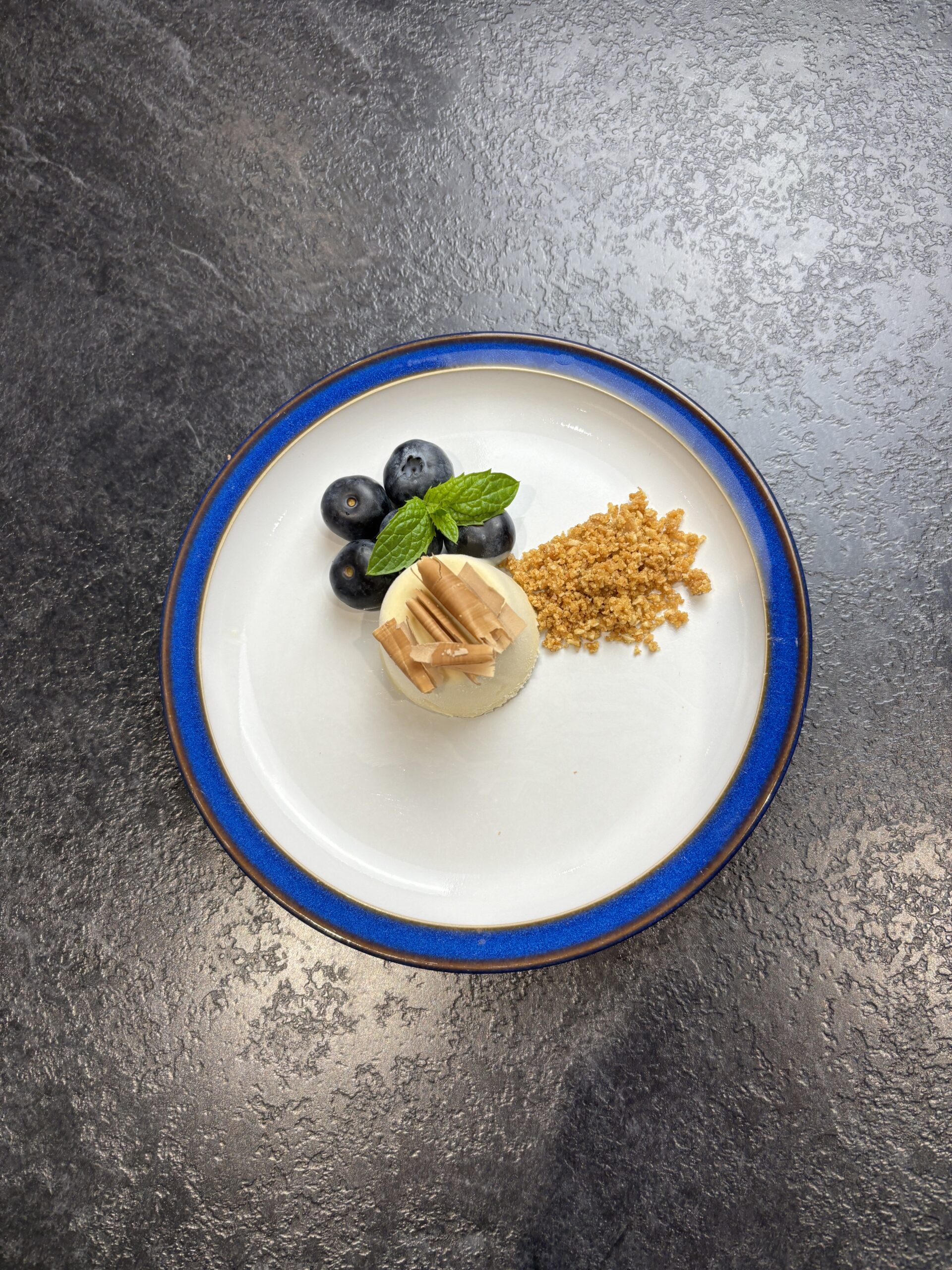 Baileys Ice Cream with biscuit crumb blueberries and shaved chocolate