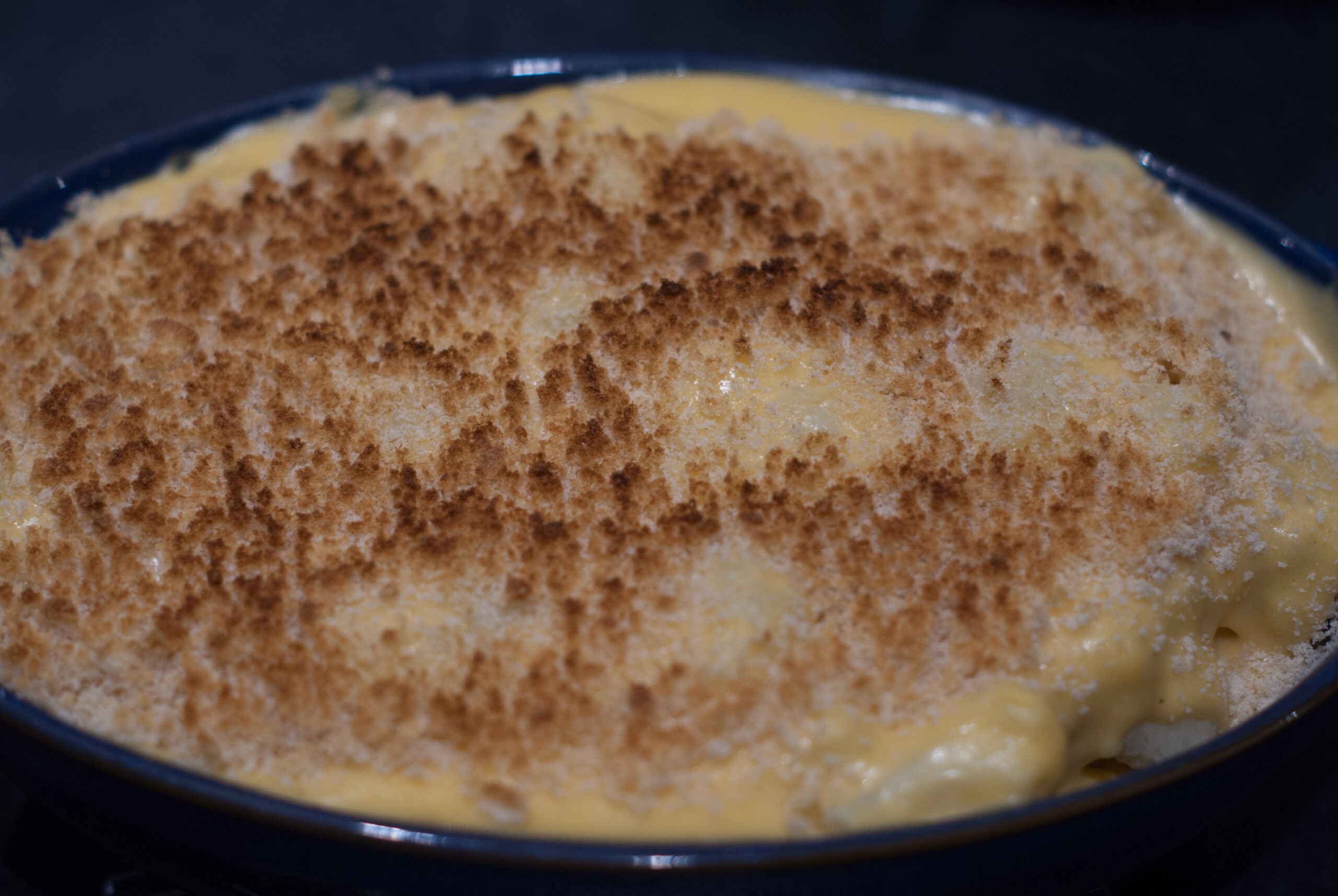 finished cauliflower cheese with breadcrumbs on top