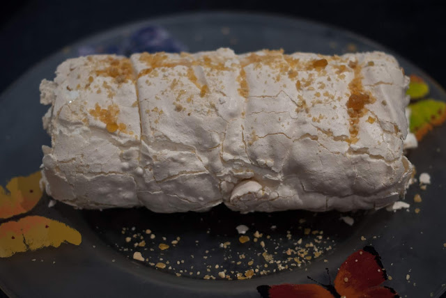 Meringue Roulade on a plate ready for serving